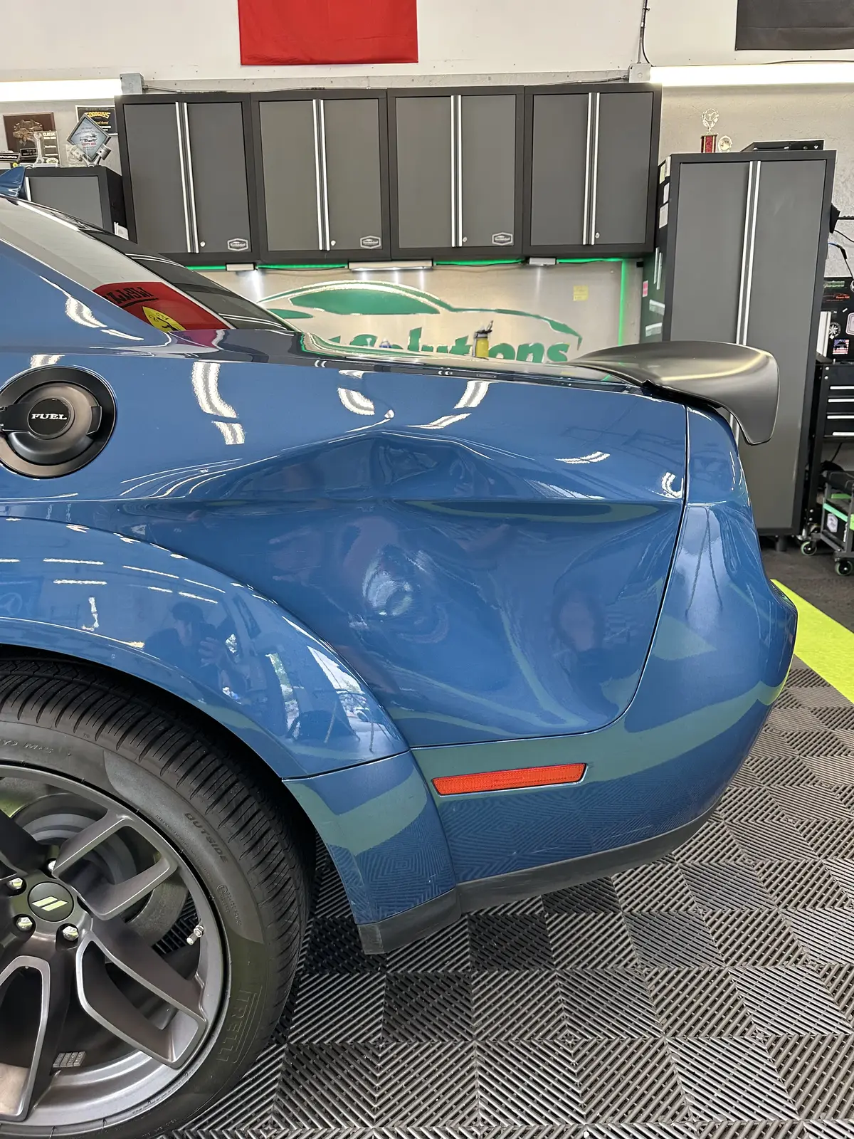Quarter panel dent before repair