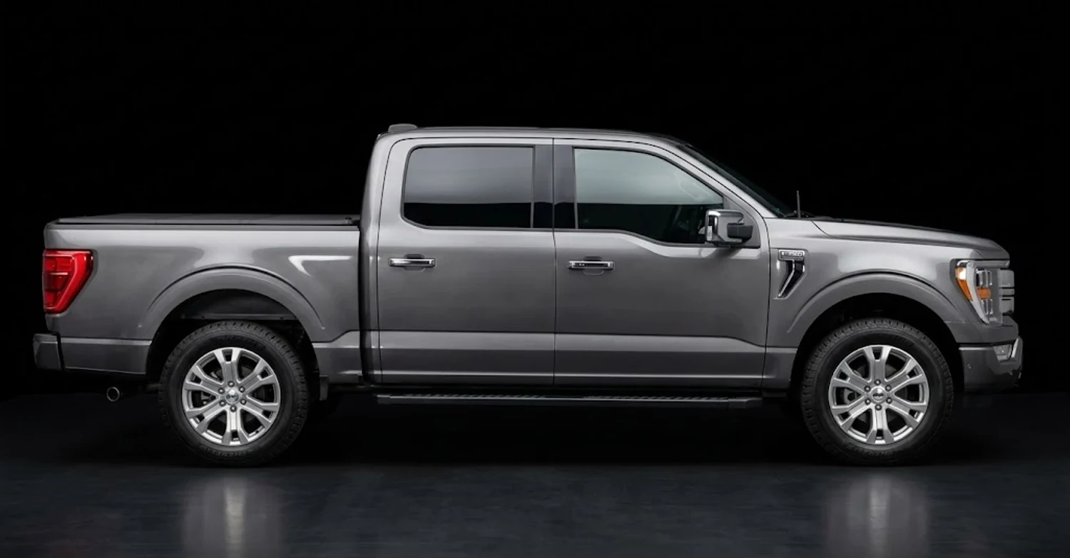 A gray Ford F-150 pickup seen from the side