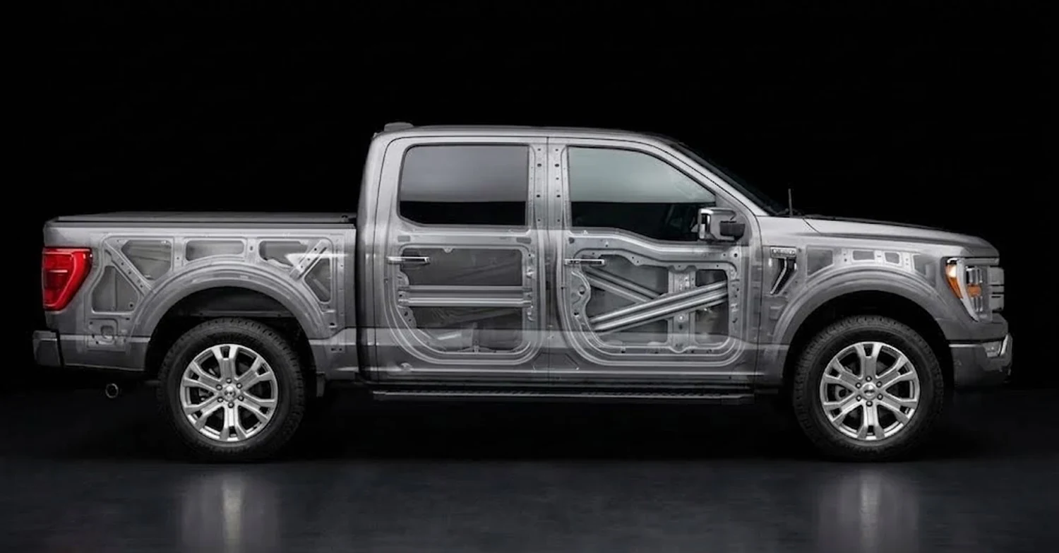 The same Ford F-150 with the panels made transparent, showing the beams inside both doors and the bracing behind the bedside